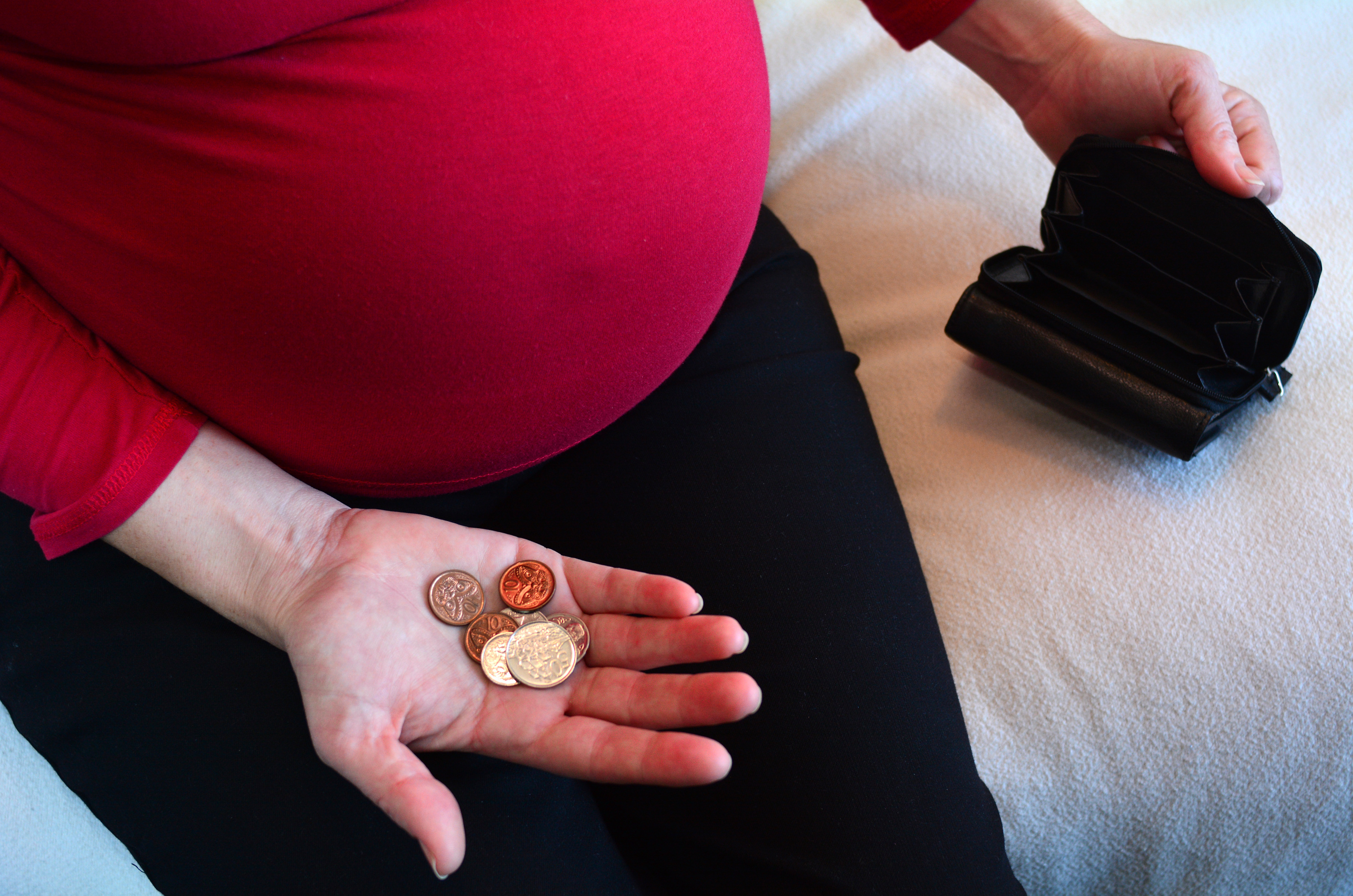 Pregnancy - pregnant woman money and finance give up baby for adoption